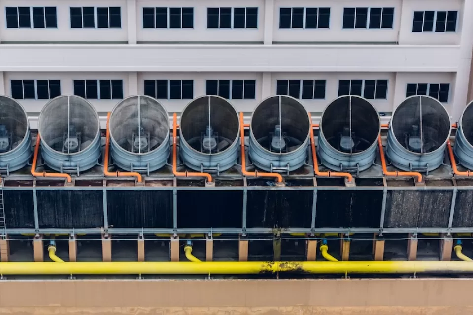 Aerial view of cooling towers on data center roof.